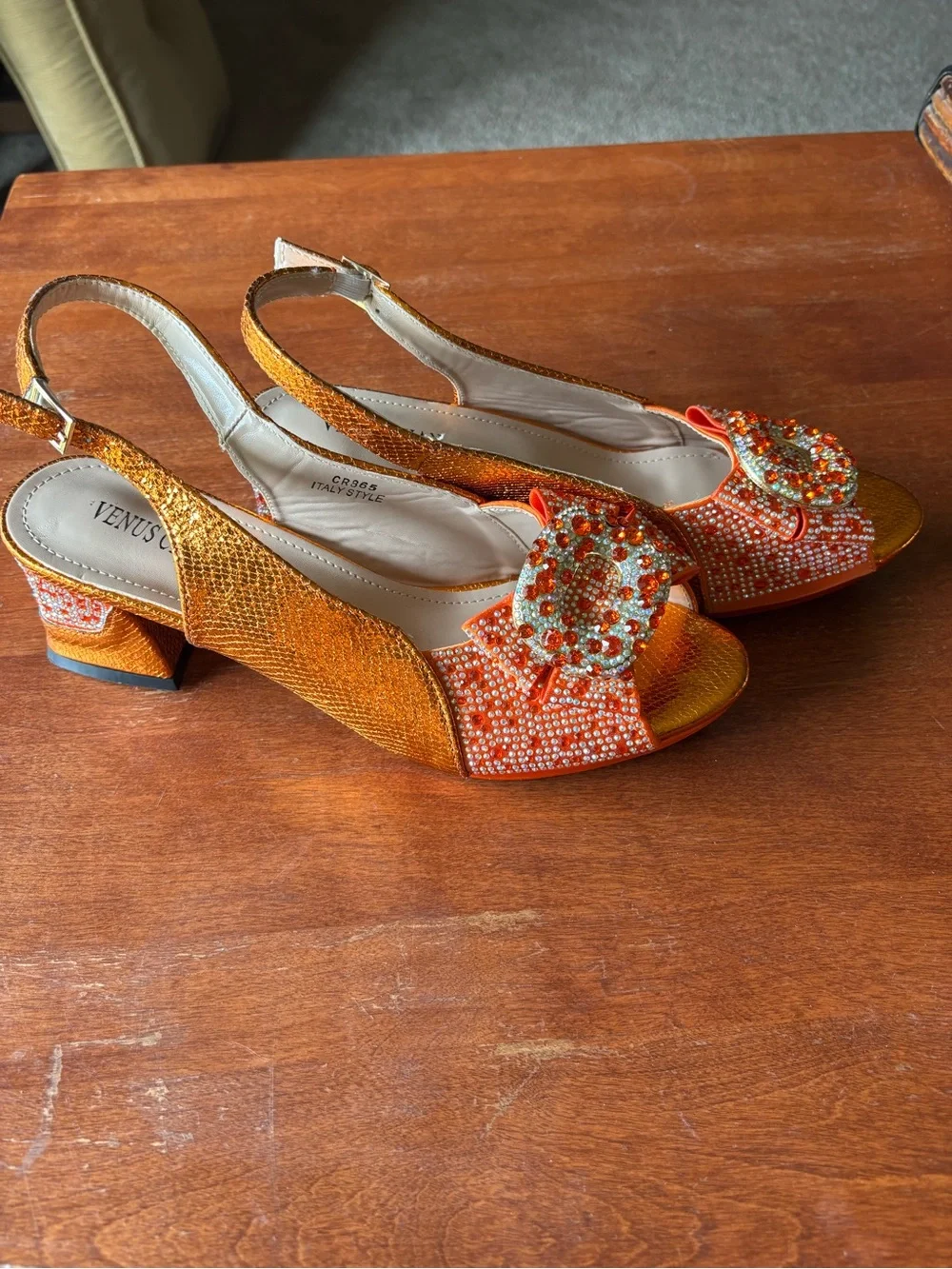 Venus Chan slingback heels w vibrant crystal-encrusted ornament on the peep toe.
